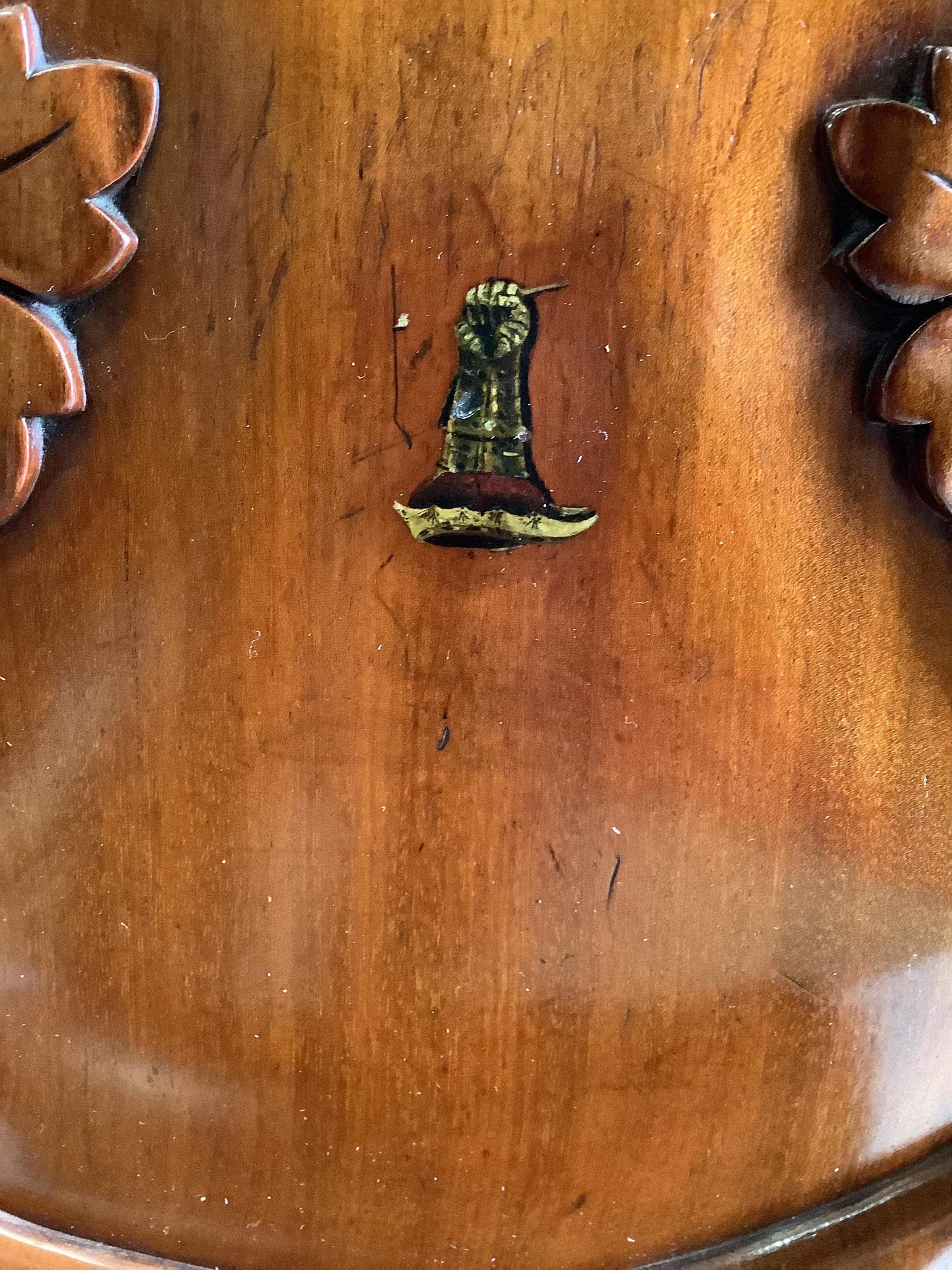 A pair of William IV Irish mahogany hall chairs with painted armorials, width 44cm, depth 38cm, height 84cm. Condition - good